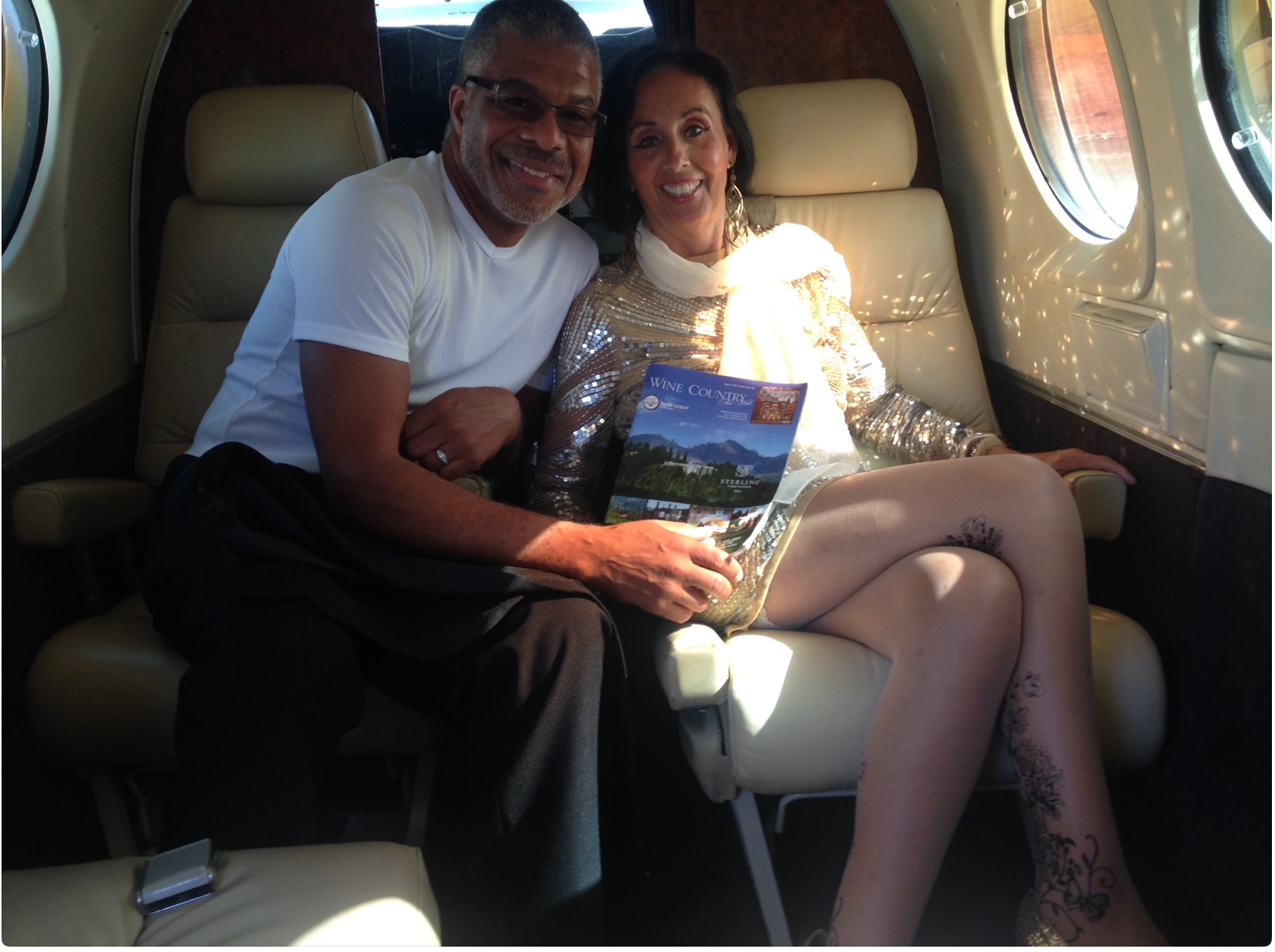 Brandon Oliver and his wife on a private jet - Dealioz founder